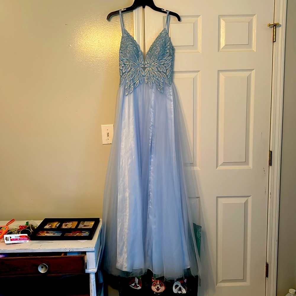 I wore this one time for military ball it’s beautiful no rips or stains